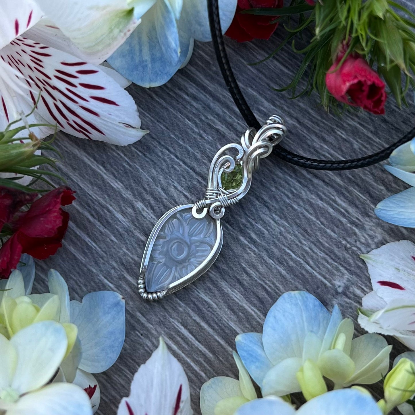 Carved White Moonstone with Peridot Pendant in Argentium Silver